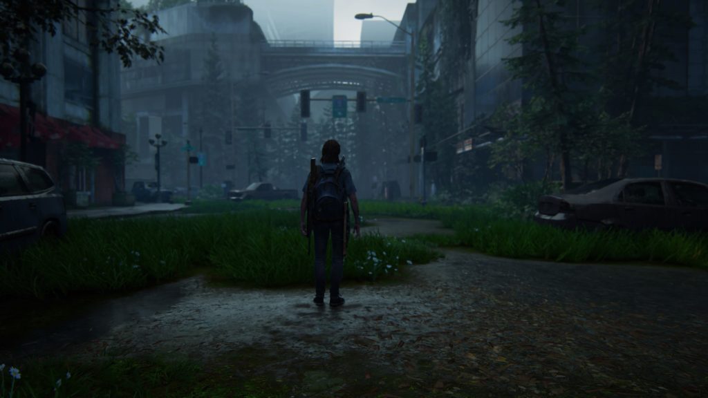 Ellie stands alone in Seattle's abandoned streets, TLOU2
