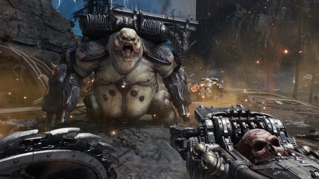 The Slayer walks towards a demon with a nasty looking weapon in hand
