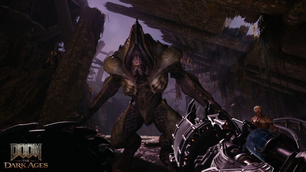 The Slayer walks towards a demon with a nasty looking weapon in hand